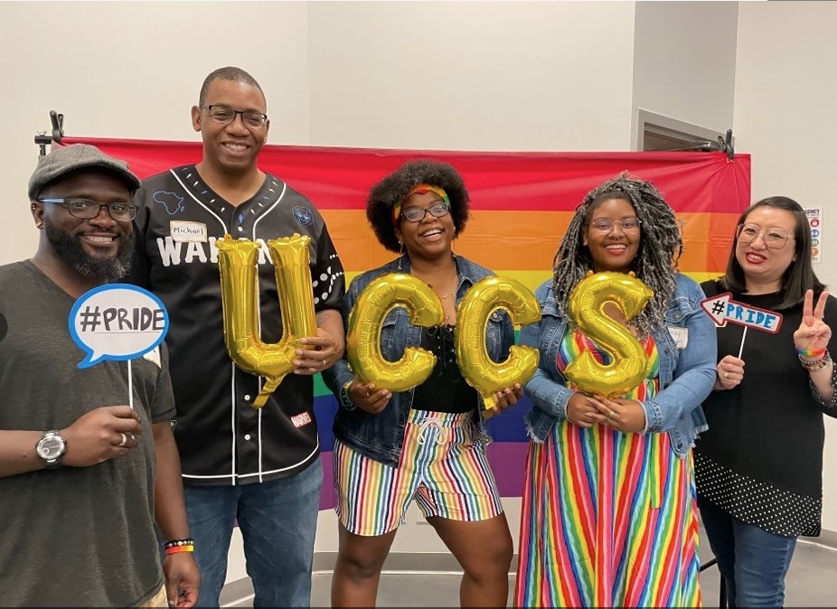 Group of people representing PRIDE at MOSAIC office
